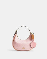 C*ACH - Emil* Shoulder Bag In Signature Canvas With Charms - Pink