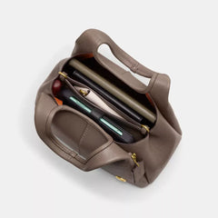 C*ACH - Lan* Shoulder Bag 23 - Brass/Dark Stone