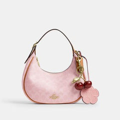 C*ACH - Emil* Shoulder Bag In Signature Canvas With Charms - Pink